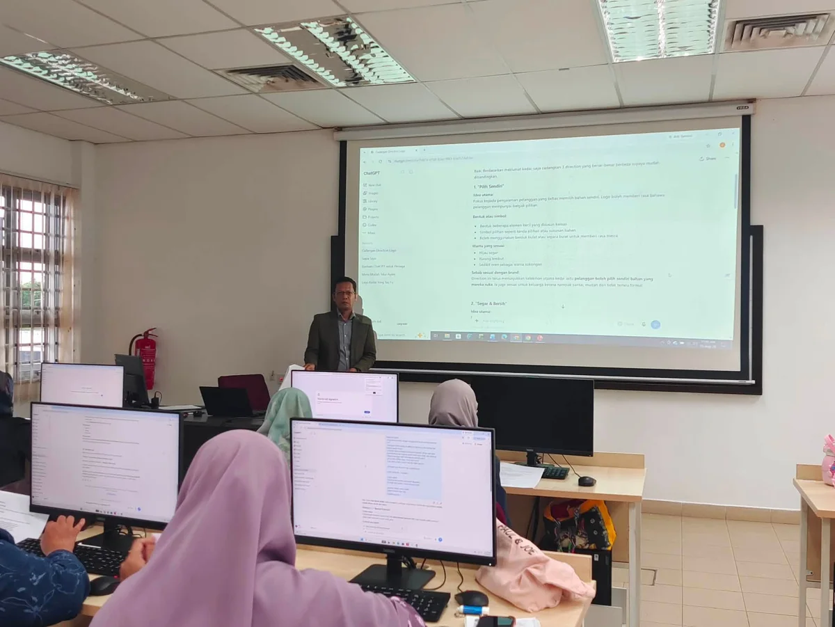 Coach Adi Zain Coach Adi Zain demonstrating Claude to participants in a computer lab