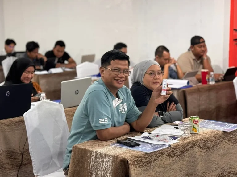 Participants working on digital marketing activities at laptops